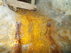 The water in the Gold mine tunnels contain chemicals that turn the rock yellow in colour.