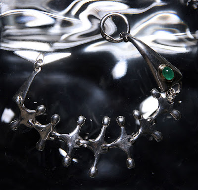 fishbone bracelet with emerald by alex streeter