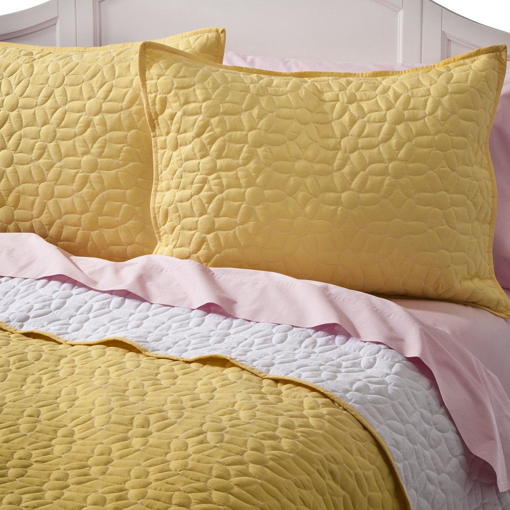 Learning. Living. Giving. bunk beds, quilts and designer pillows