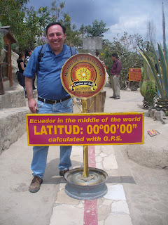 a man standing next to a sign