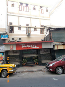 "Pushpak International Hotel" on Mirza Ghalib Road.