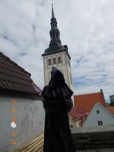 "Hooded Monk" statue next to Town Wall.in Tallinjn Old Town.