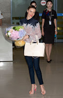 Miranda Kerr with a flower bouquet