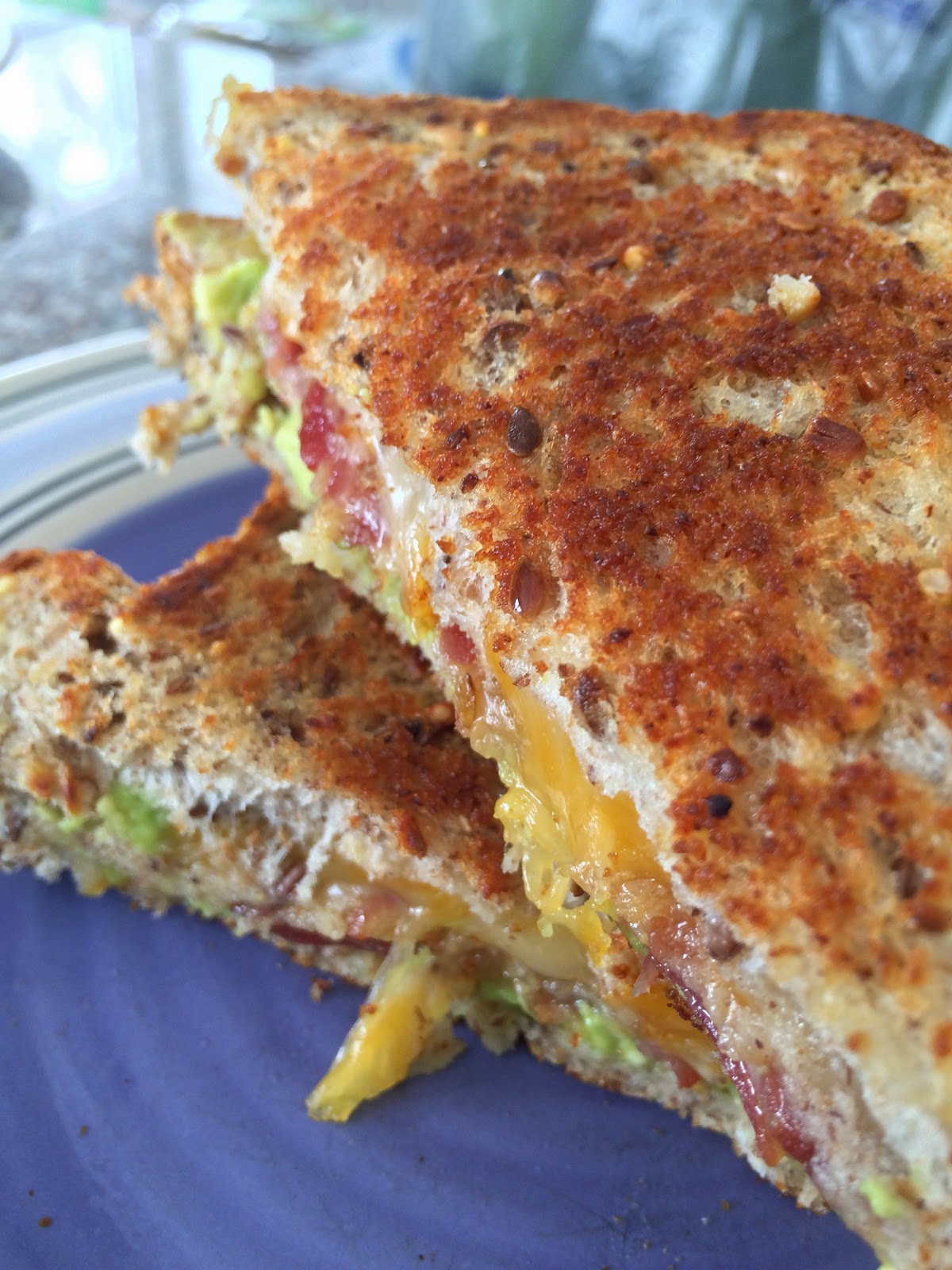 two happy bellies. bacon guacamole grilled cheese.