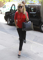 Reese Witherspoon red hot in a red shirt and tight black pants