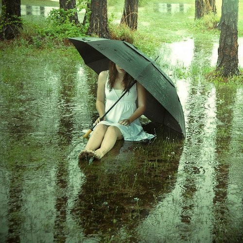 Sad alone girl in rain