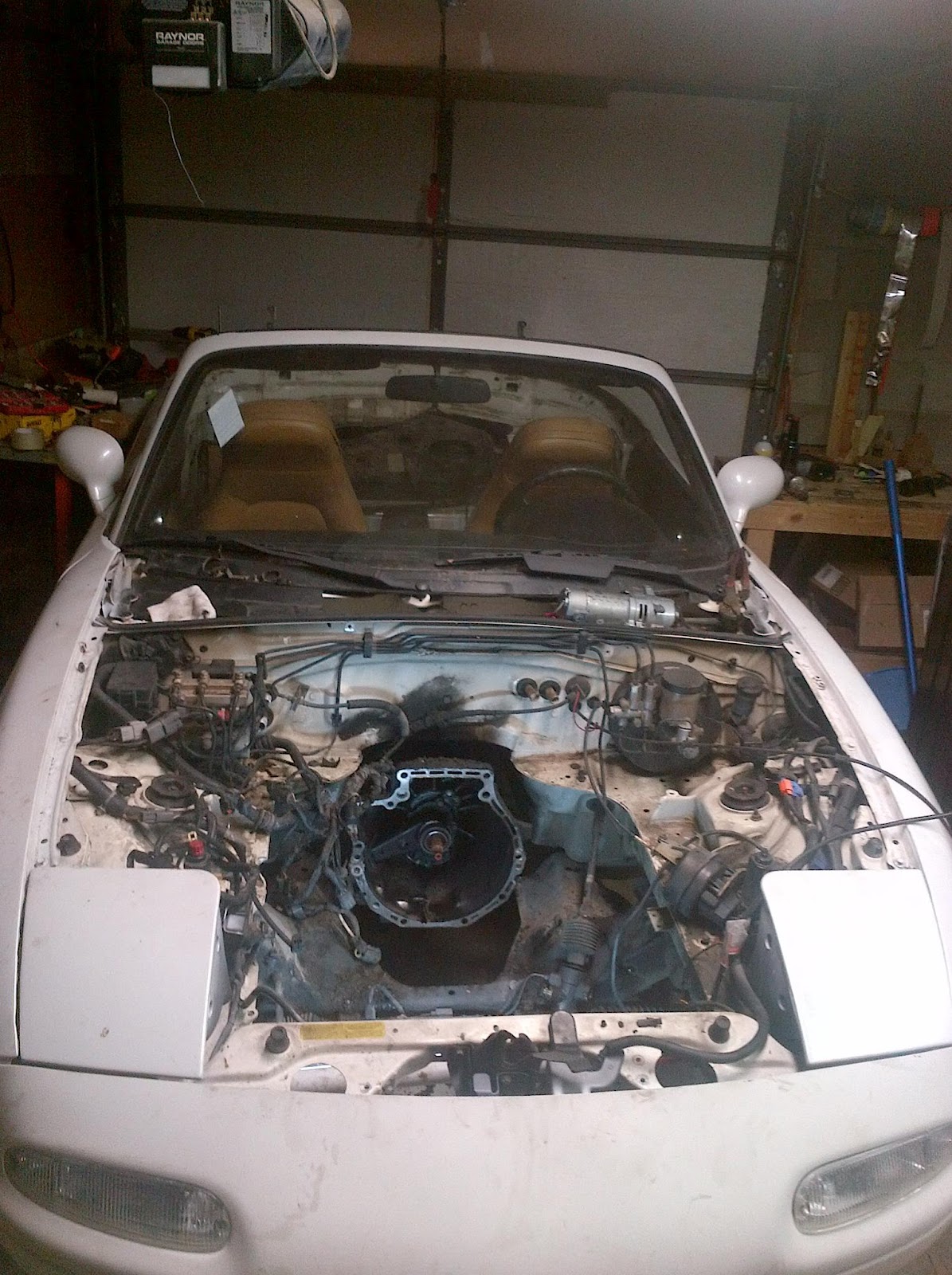 Electric Miata Old engine out, just waiting for the new motor