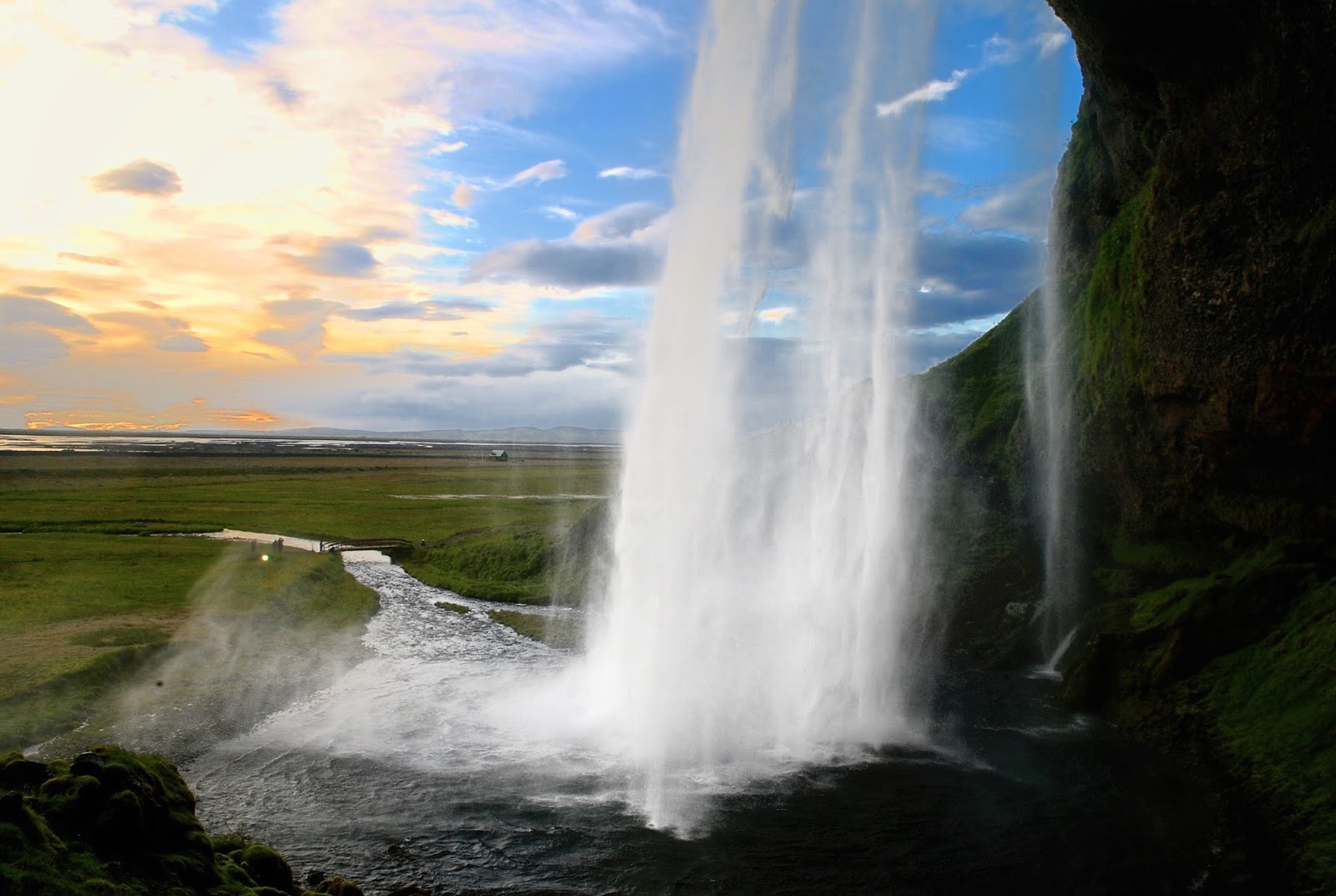 Sunset from behind Seljalandsfoss waterfall on the South Coast of Iceland