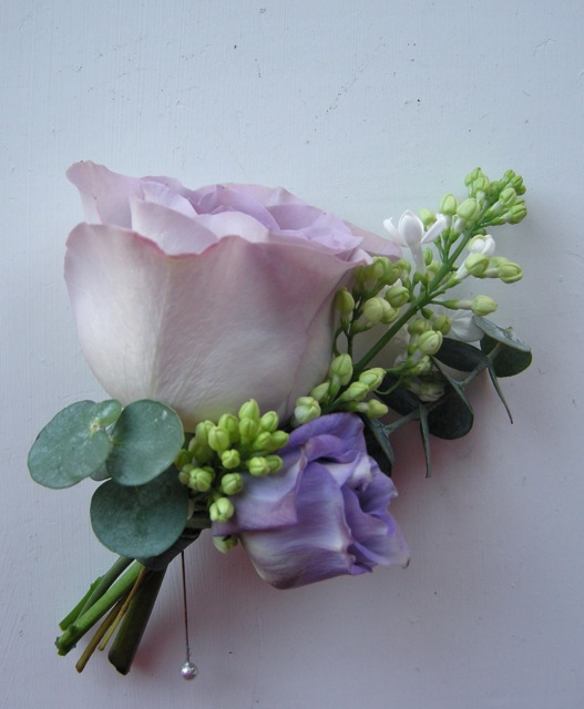 Groom's buttonhole of Rose Lilac Lisianthus and eucalyptus
