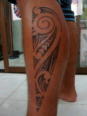 Maori style leg tattoo