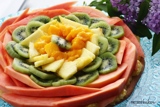 Sugar Cookie Crust with fresh papaya, mango, pineapples and kiwi fruit. It's a Tropical Fruit Pizza for the WIN!