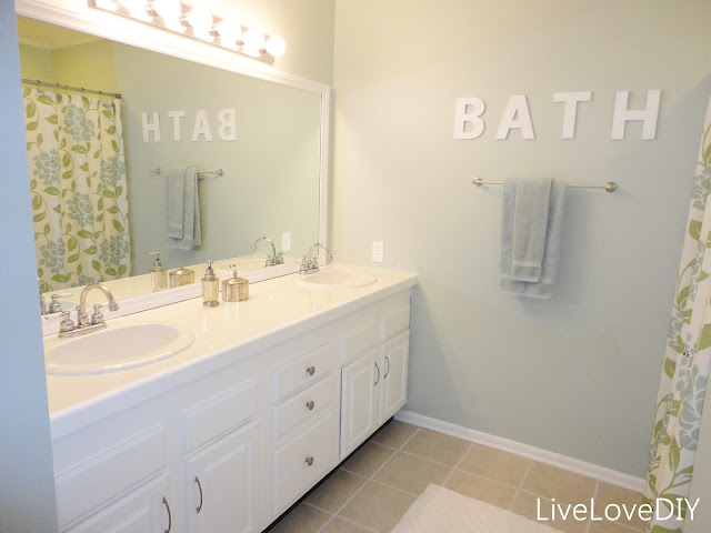 Easy DIY ideas for updating older bathrooms. So many great ideas including how to paint tile & grout, and how to frame in a mirror!