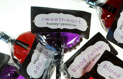 Honey-Jasmine flavored sucker in a pile of our Love Triangle lollipops