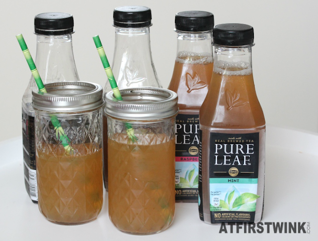 Pure leaf ice tea mint, raspberry, peach, lemon in glass mason jars with bamboo straws