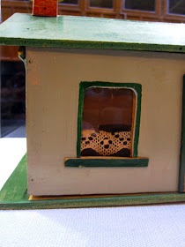 Side view of a vintage Walther & Stevenson miniature farm house building.