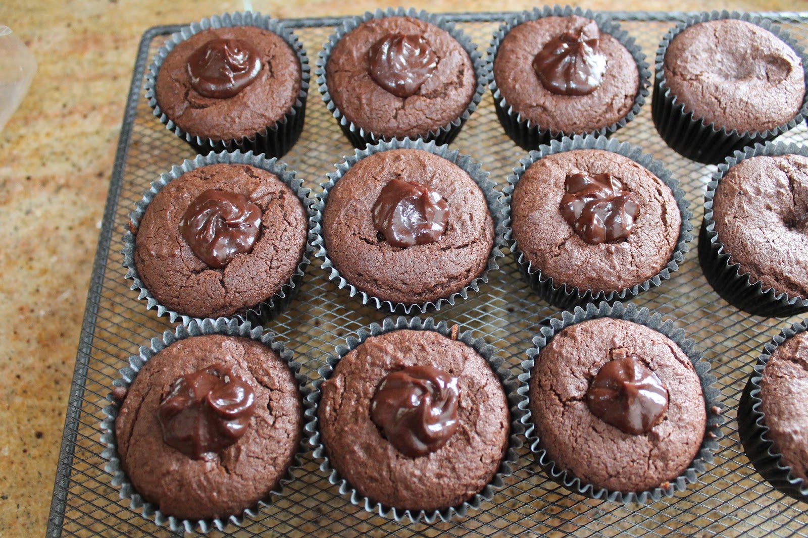 The Baker Dark Chocolate Raspberry Ganache Cupcakes