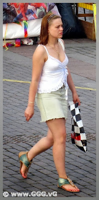 Girl in summer skirt on the street