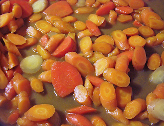 Multicolored Carrots Simmering in Buttery Broth