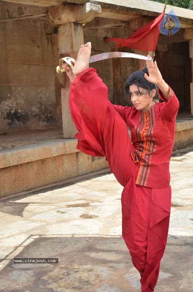 Sriya sharan doing a high kick - (2) -  Shriya Saran red outfit photo from Chandra