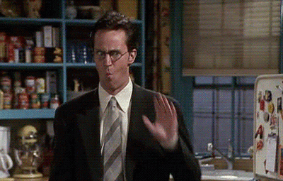 Animated gif of Chandler Bing backing away while mouthing "WOW"