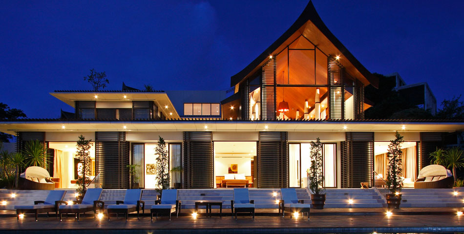 Photo of front facade and furniture by the pool of modern villa in Phuket