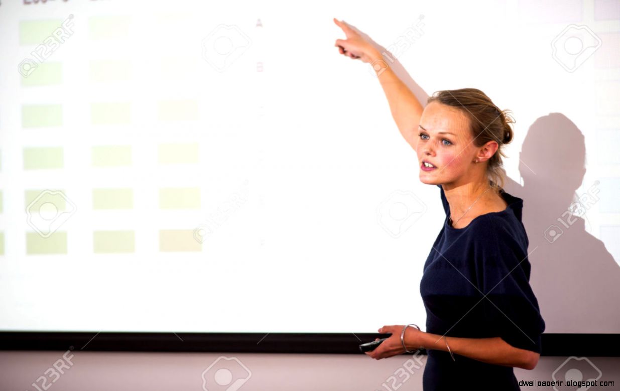 Pretty Young Business Woman Giving A Presentation In A Conference Pretty Young Business Woman Giving A Presentation In A Conference