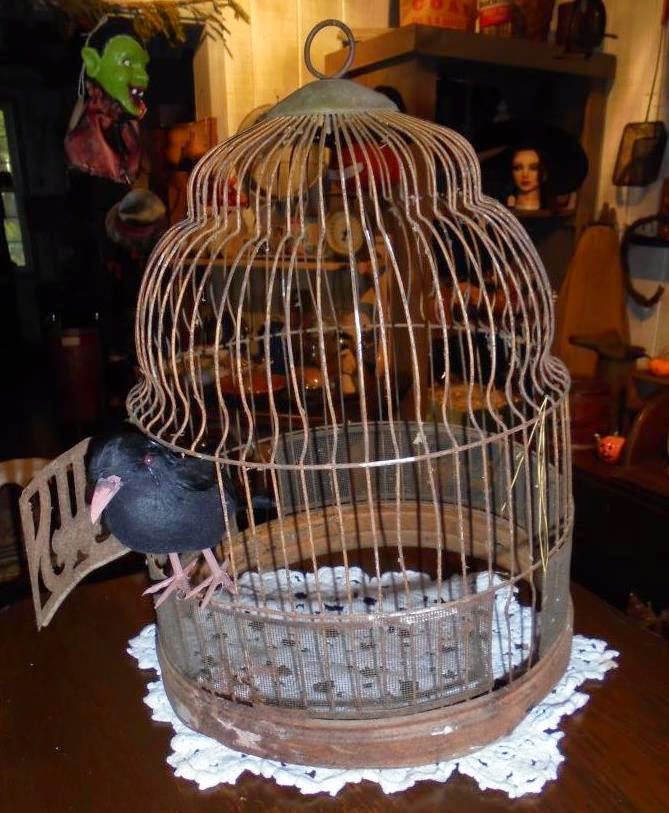 Log Cabin Antiques & Gifts Rusty bird cage with crow