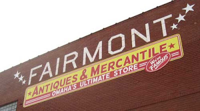 Sign reading Fairmont Antiques & Mercantile, Omaha's Ultimate Store - We're Famous