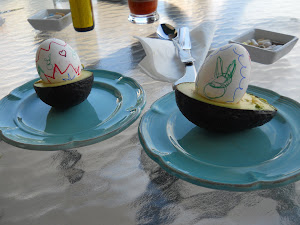 The Easter Bunny plopped our eggs into avocado halves.  Clever guy, he...hee hee.