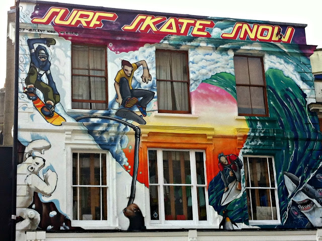 Surf, skate and snow board shop with cool graffiti advertising, Bristol
