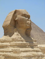 Classic side view of The Great Sphinx, Giza (Khufu Pyramid behind)