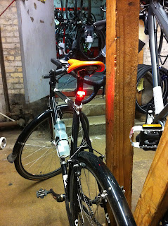 Mount red lights facing the rear on the seat post high above the tire.