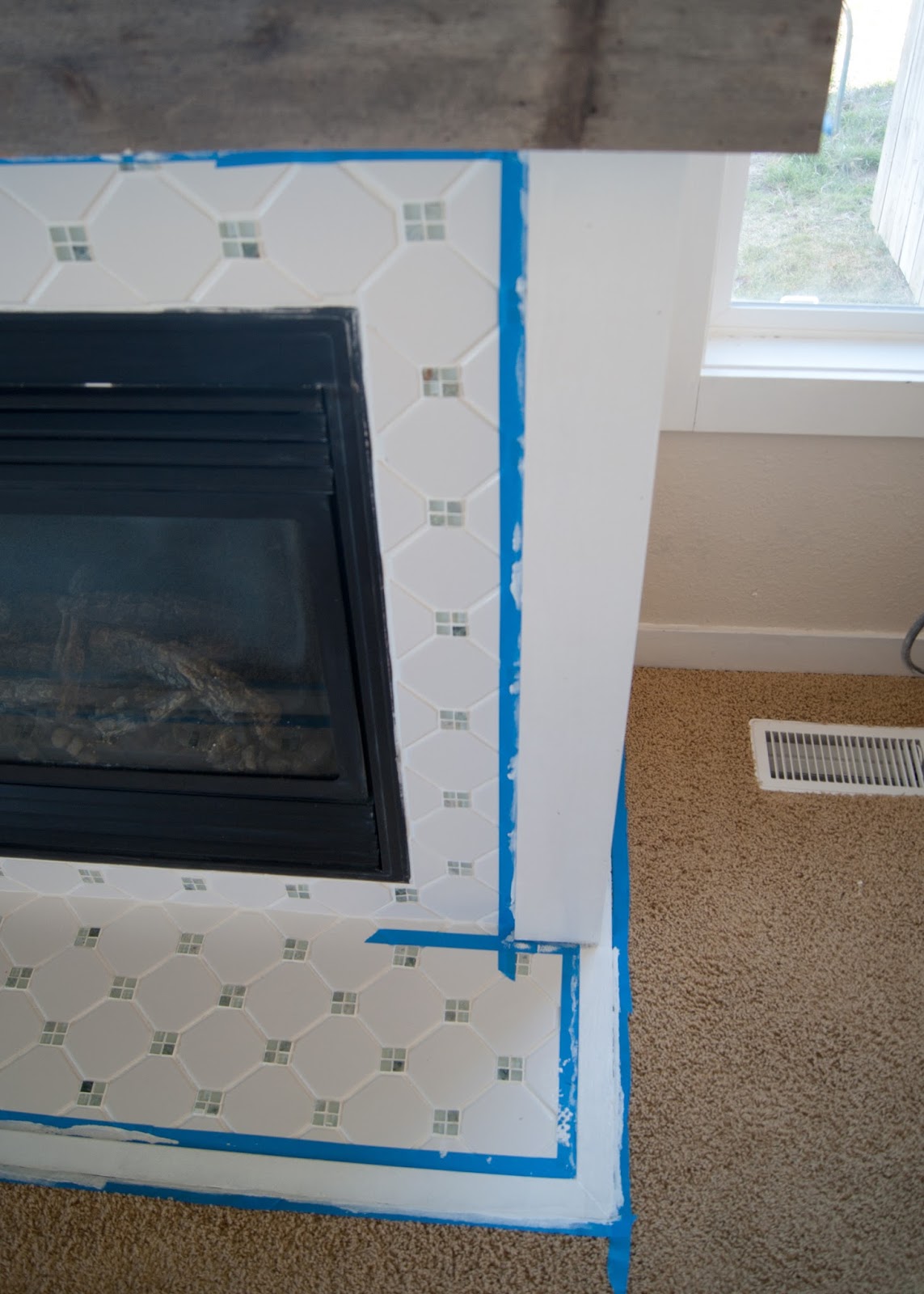 Fireplace Makeover - Grout, Paint & the best tool ever for caulking!
