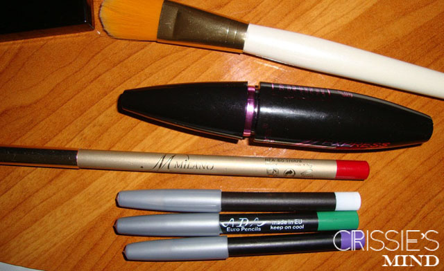 Foundation brush, mascara, eye and lip pencils