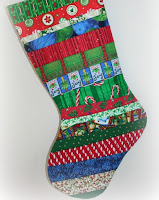 http://www.supermomnocape.com/2011/11/27/quilt-as-you-go-christmas-stocking-tutorial-part-one/