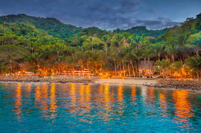 Las Caletas at night is only accessible by sea.