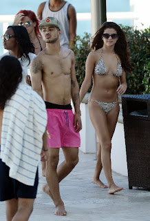 Selena Gomez wearing a Zebra Bikini and Tattoo in Miami