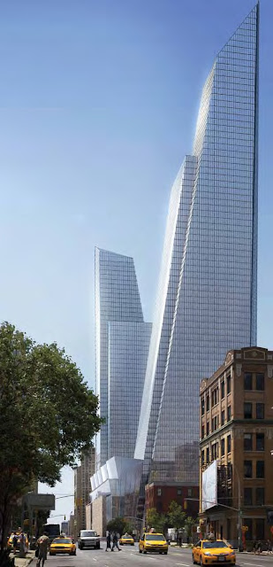 Photo of new towers as seen from the street with traffic