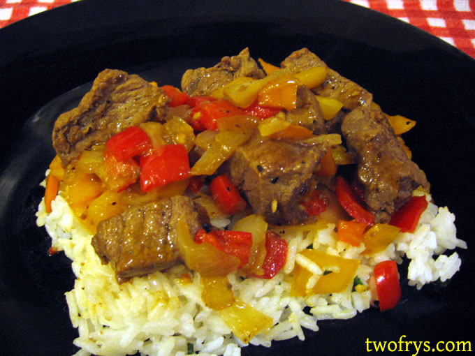 Two Frys Steak with Peppers and Onions and Basil Rice