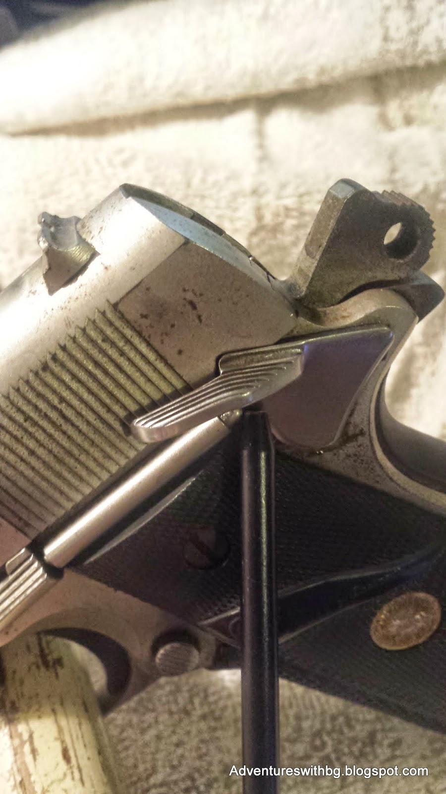 The mechanical safety on a pistol