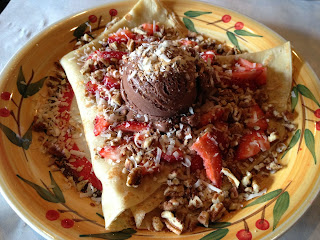 Vegan Crêpe with fresh strawberries, pecans, toasted coconut, and chocolate soy ice cream 