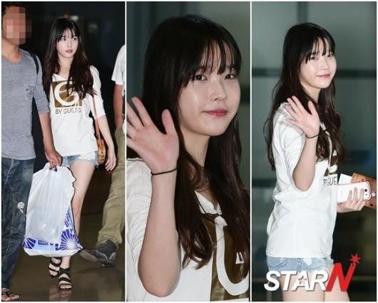 IU returned to Korea from London after cheering on Korean National soccer t...