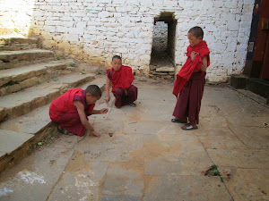 Young monk students playing "Marbles" inside  "Paro Dzhong".