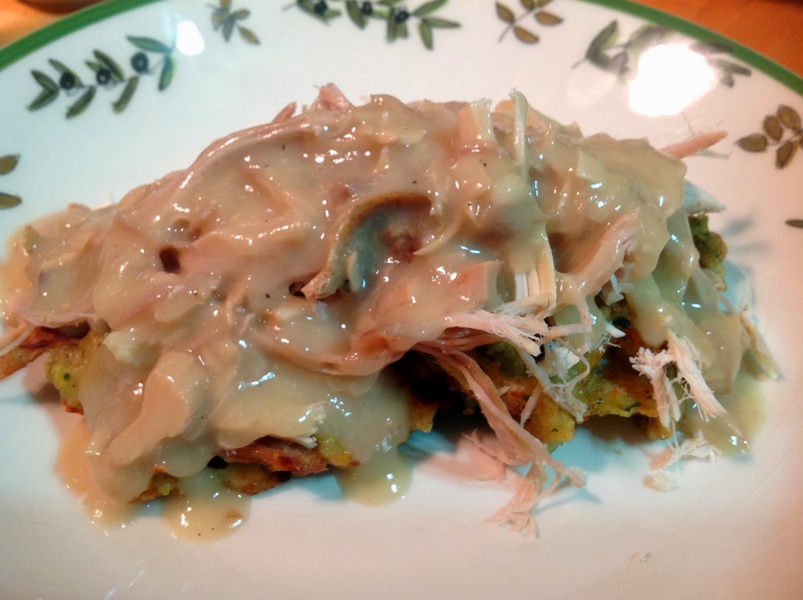 A Couple in the Kitchen Stuffing Waffles Topped with Turkey and Gravy