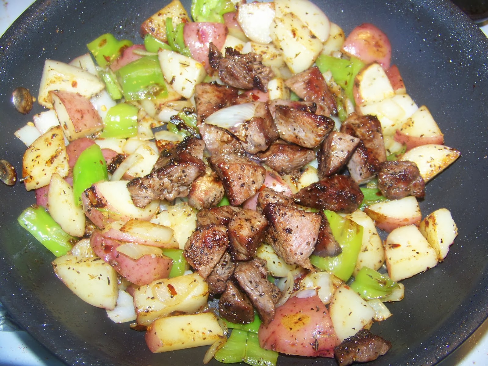 Kitchen Simmer Steak and Potato Hash Topped with a Fried Egg