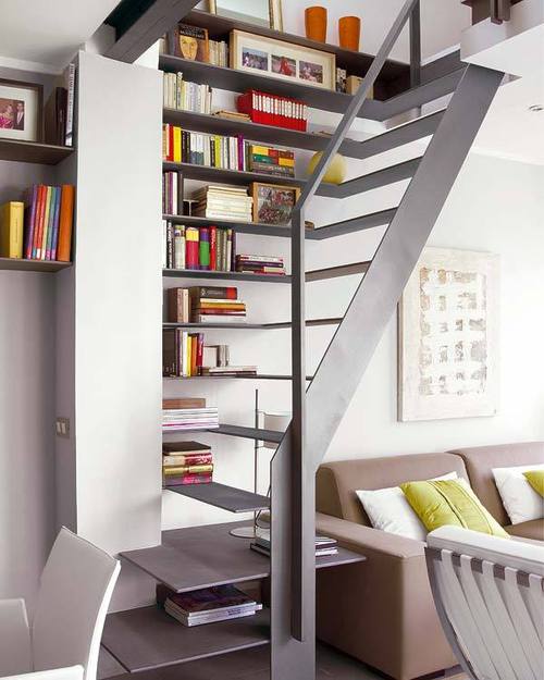 compact staircase design as bookshelves