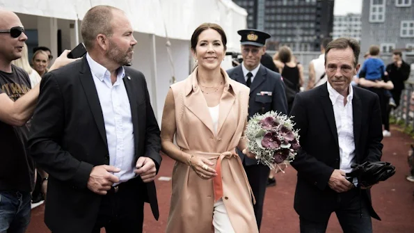 Crown Princess Mary of Denmark visited the collection stand of fashion designing students