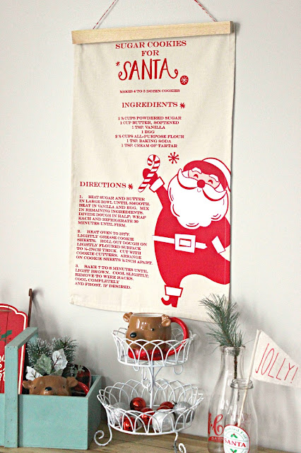 DIY Christmas Tea Towel Wall Banner. Only took 15 minutes and a few supplies to make!