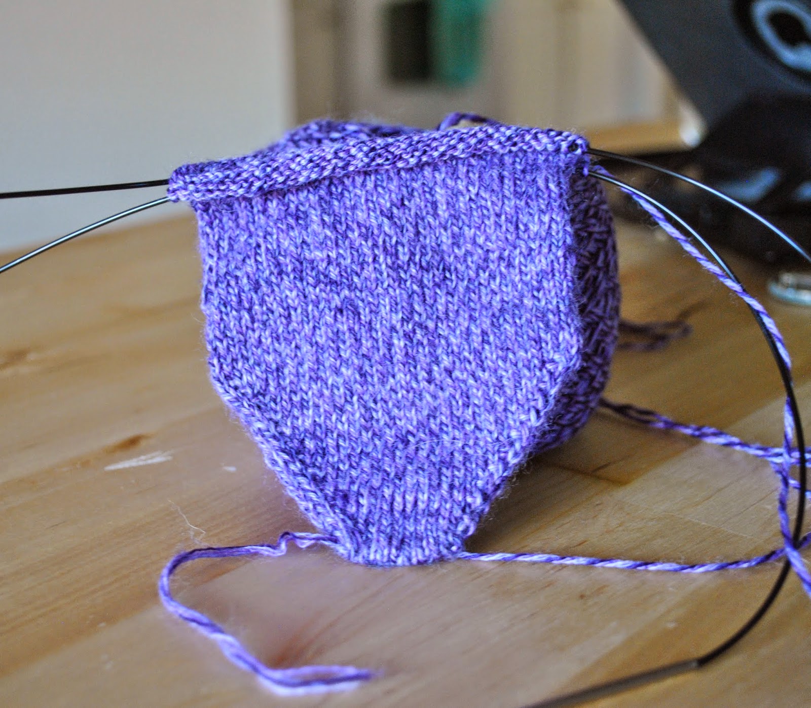 purple hand knit sock progress