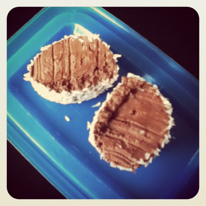 On a separate plate, sprinkle either crushed nuts or coconut and roll